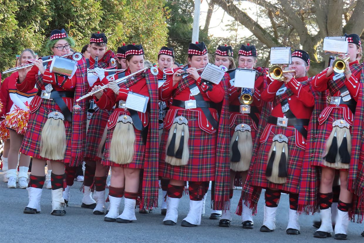 Queen's Bands members perform at the 2024 Santa Claus Parade Reception
