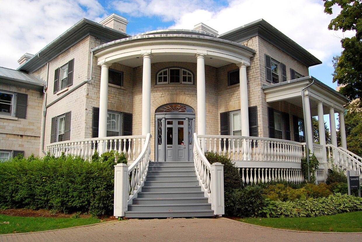 front of Summerhill House. Steps leading up to deck with large white columns