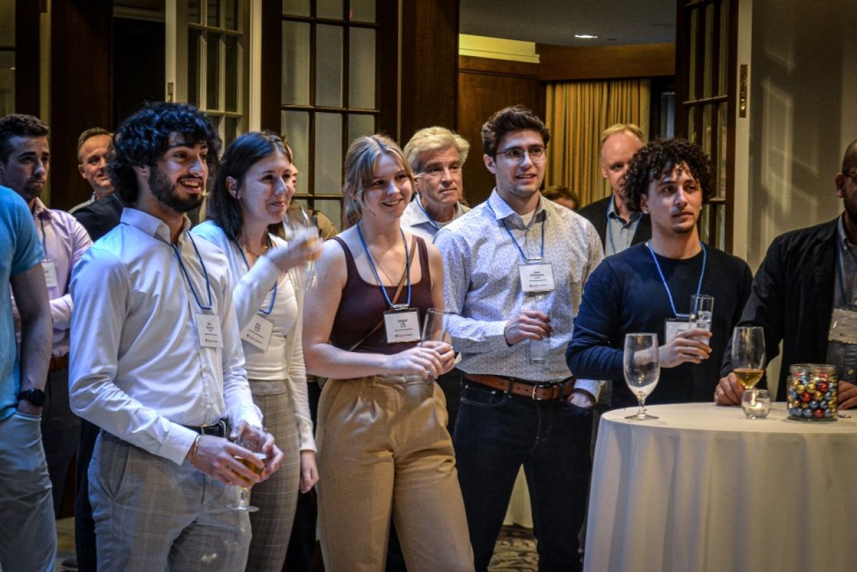 Alumni and students listening to Dean Deluzio speak