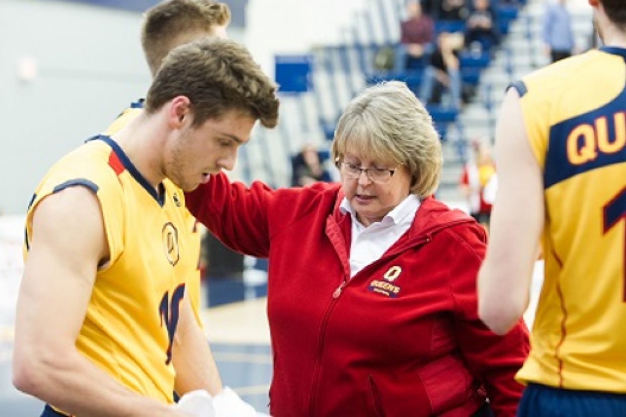 Brenda Willis with men's volleyball team