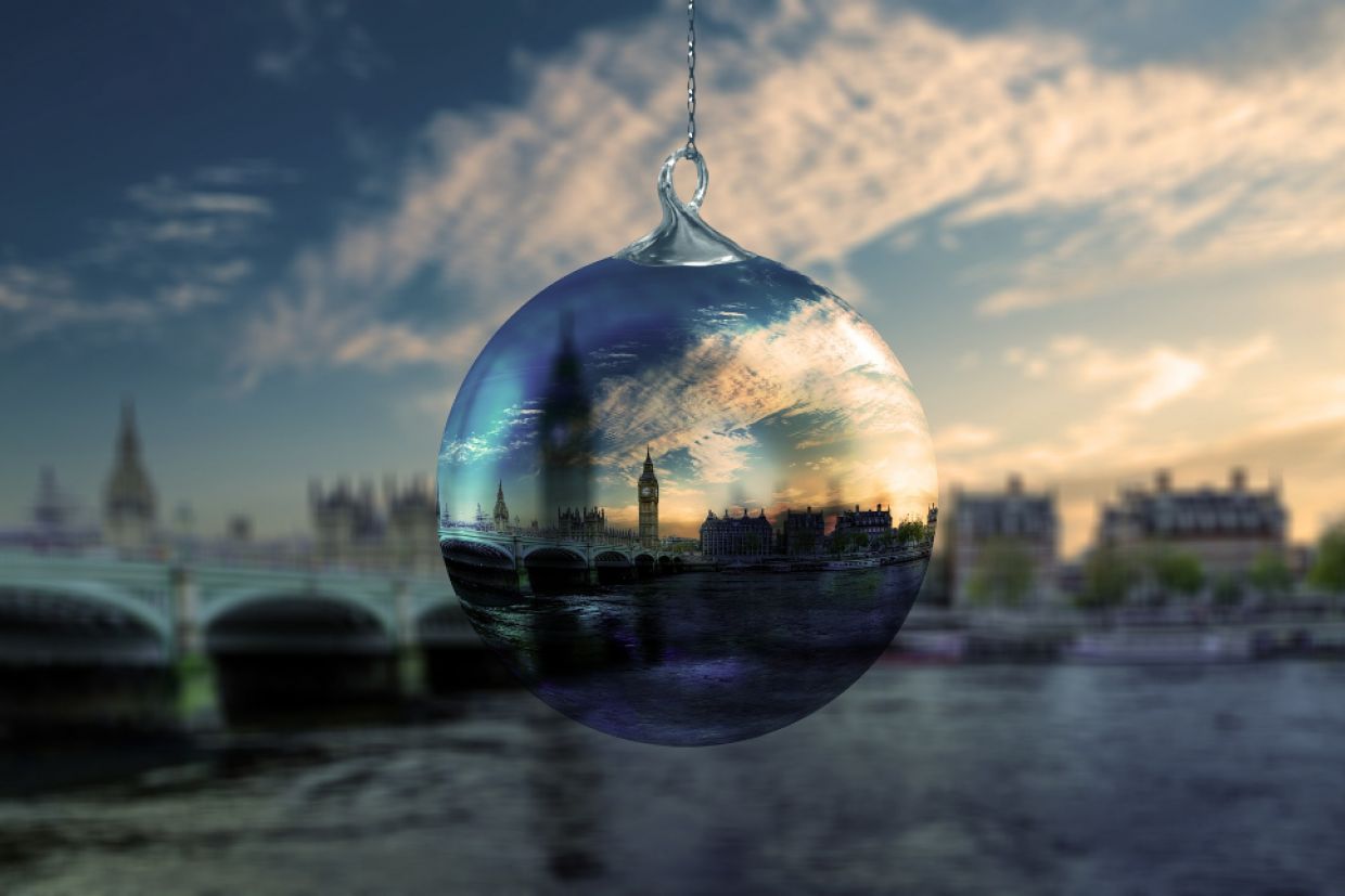 A Christmas ornament with a view of London inside it