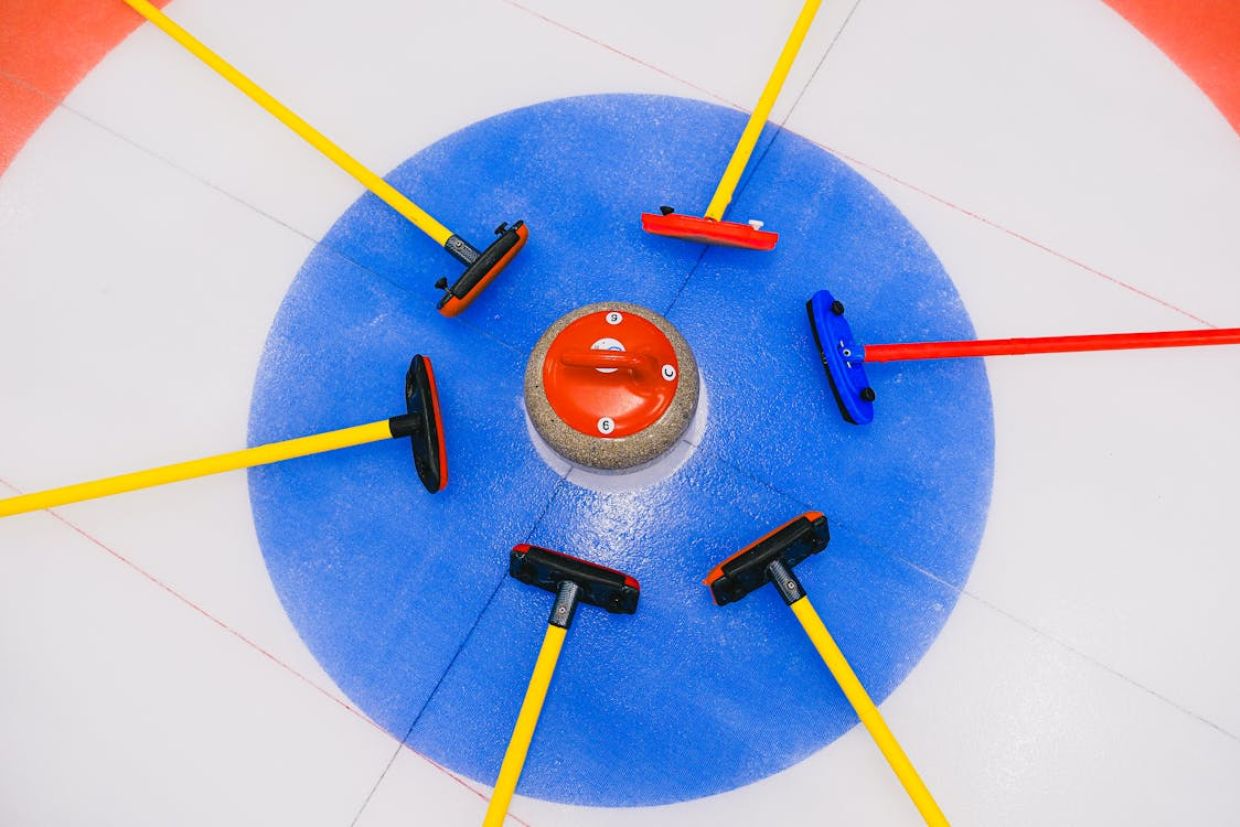 Curling brooms on ice