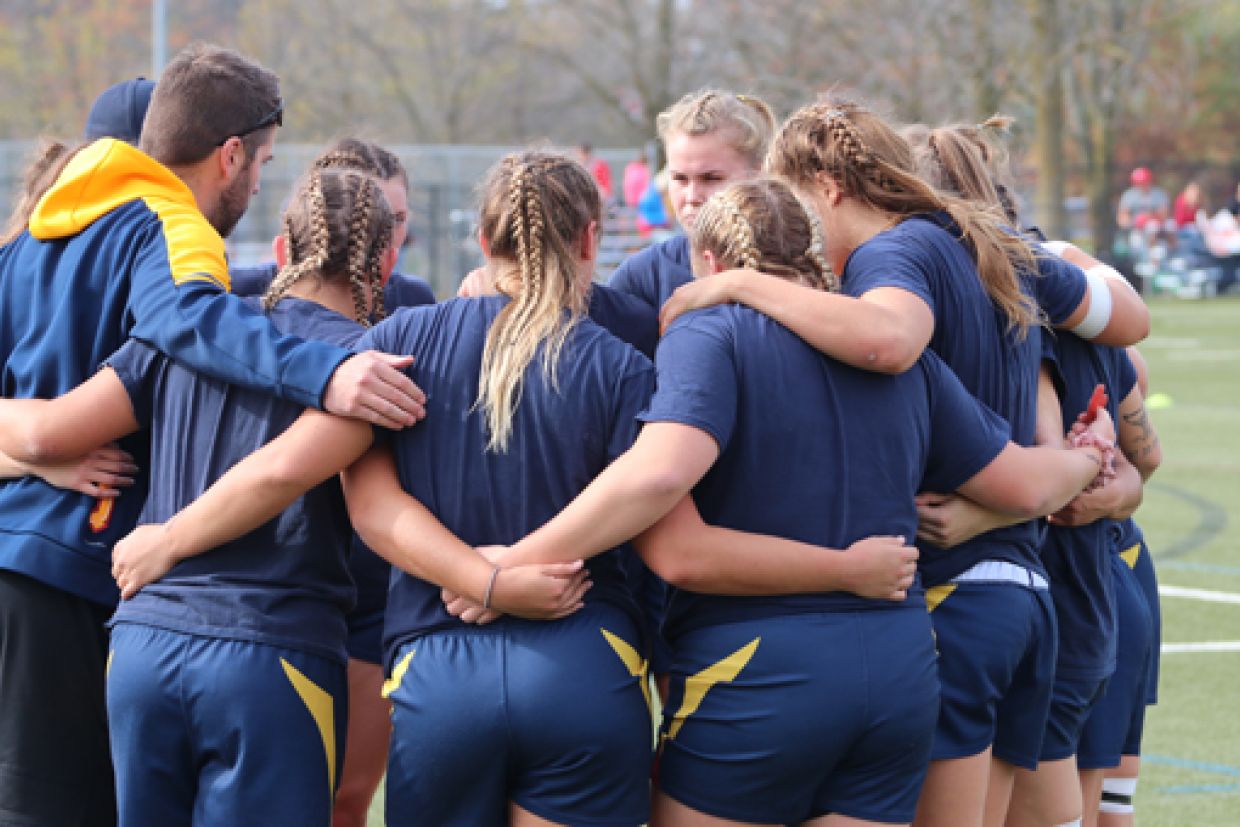 women's rugby huddle