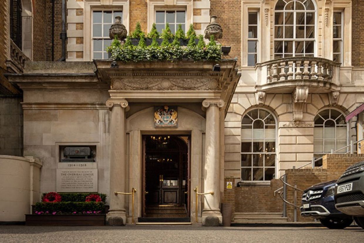 Stone façade of the Royal Over-Seas League in London, UK.