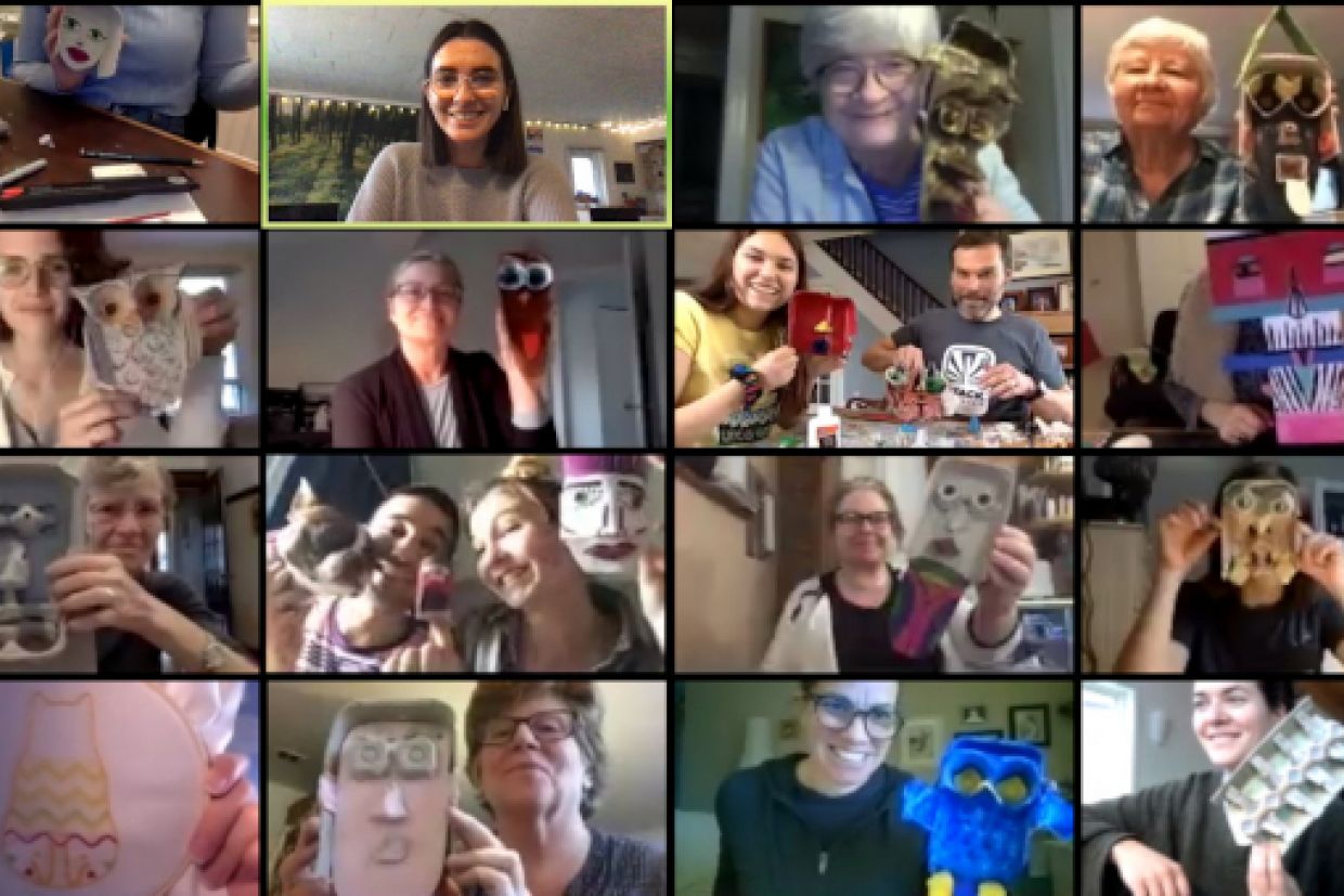 Participants pose with art creations from home