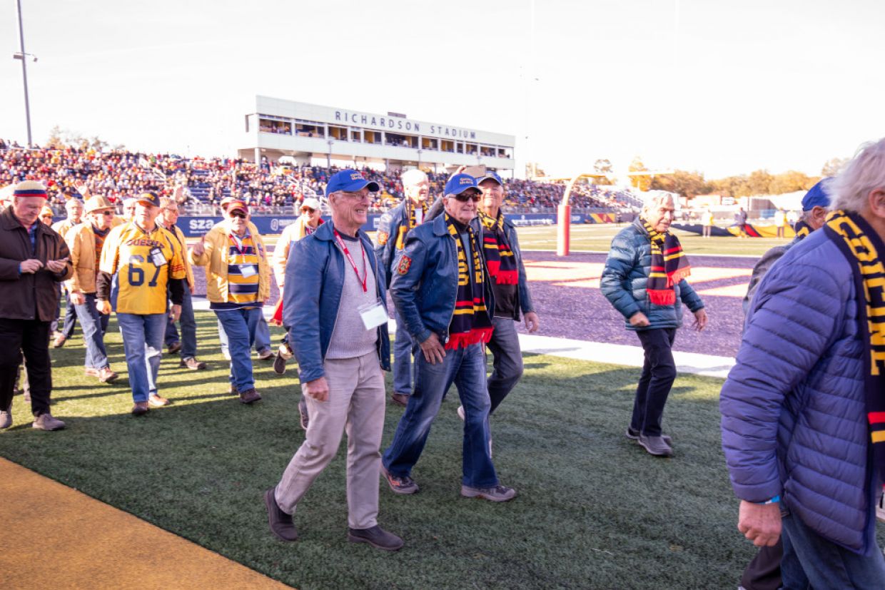 Members of Tricolour Guard parade around Richardson Stadium.