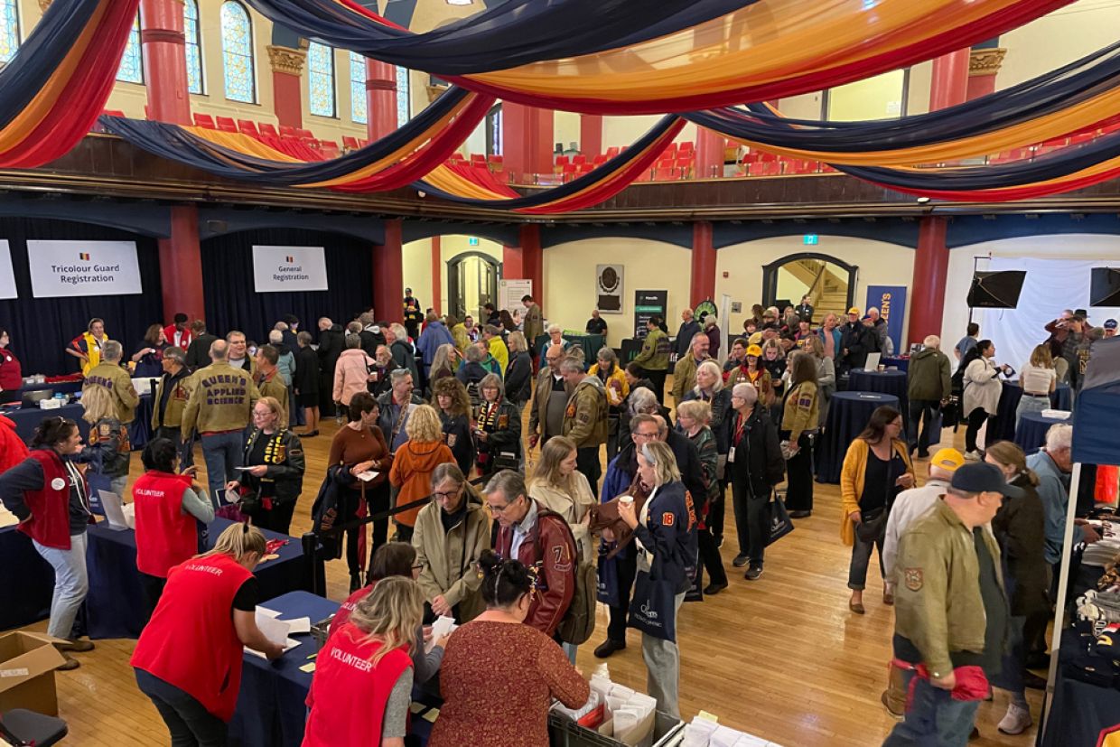 Crowd of people lining up in Grant Hall during Homecoming