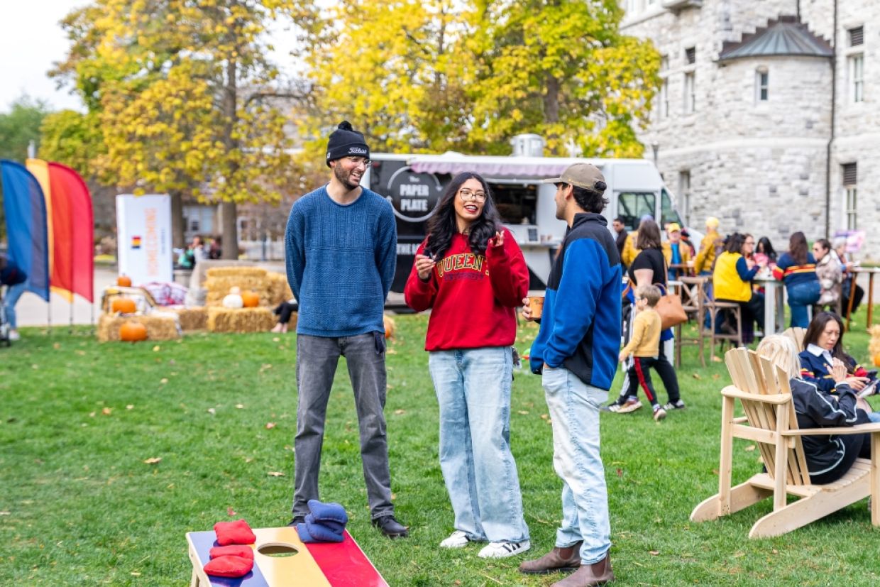 Alumni play lawn games at fall harvest gathering