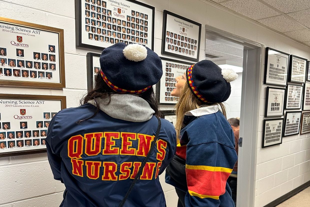 Nursing alumni look at class photos