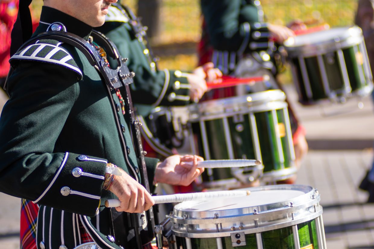 Drummers walking in the alumni parade to Richardson Stadium