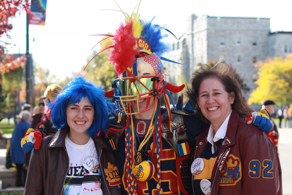 Superfan and alumni taking a photo together 