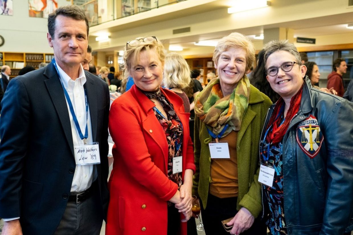 Dean Flood and Law Alumni posing for a photo credit: Rob Whelan Photography