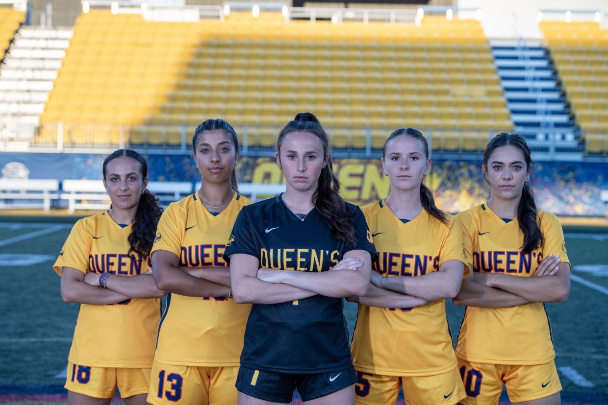5 women's soccer players posing at Richardson Stadium