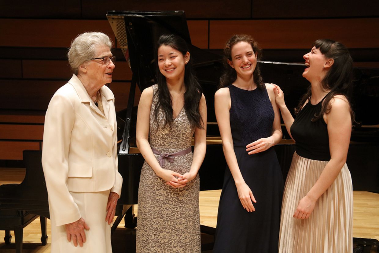 Isabel Bader, left, speaks with the finalists of the inaugural Isabel Overton Bader Canadian Violin Competition in 2017.