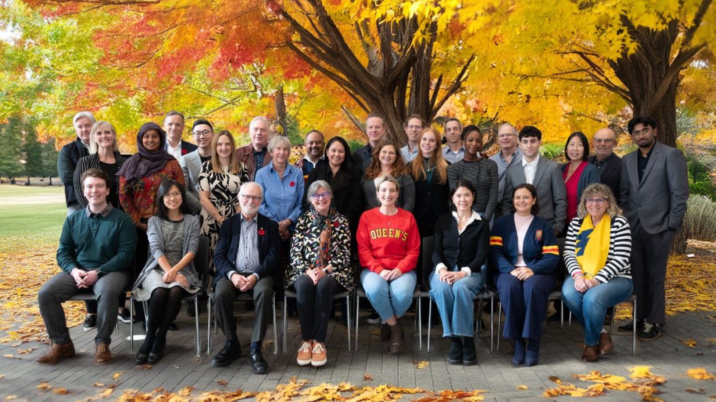 University Council pictured on campus, with a tree as background and fall colours.