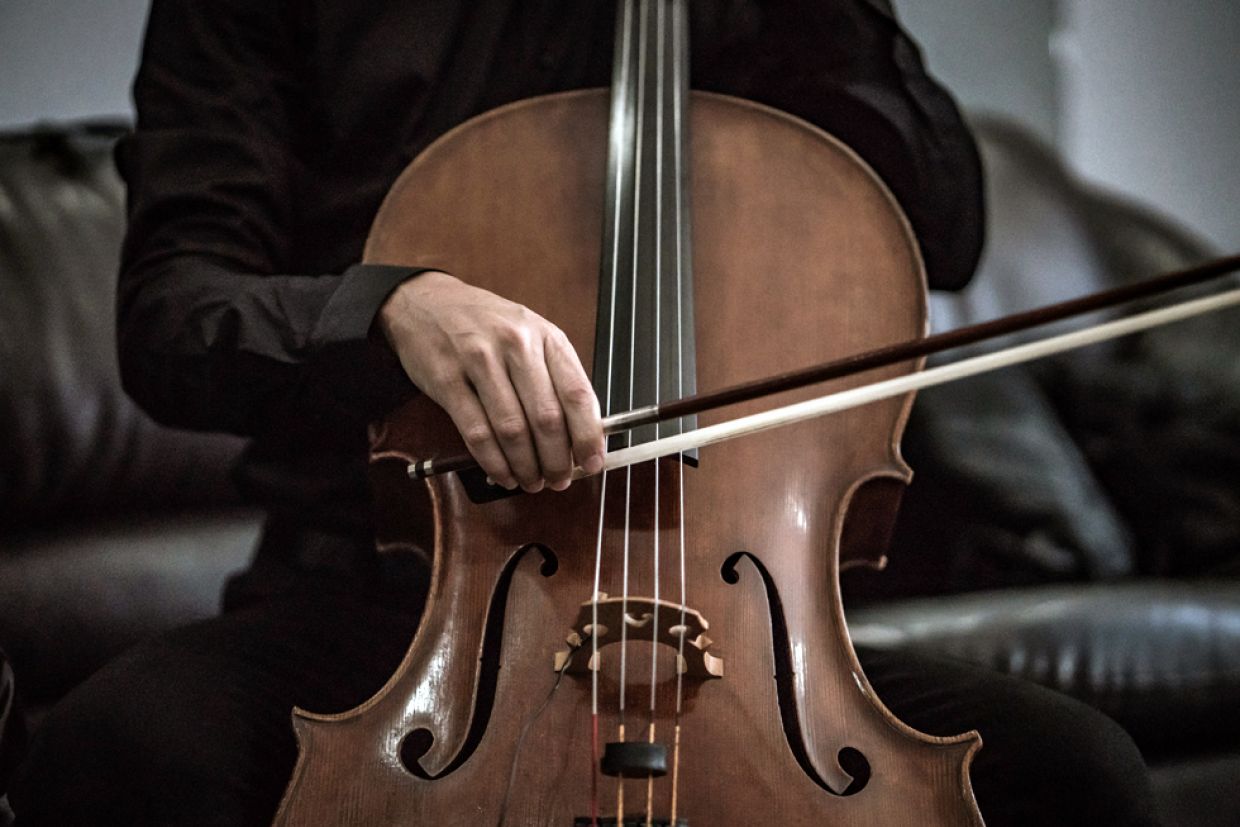 The Gift of Art: A closeup of a musician playing the cello