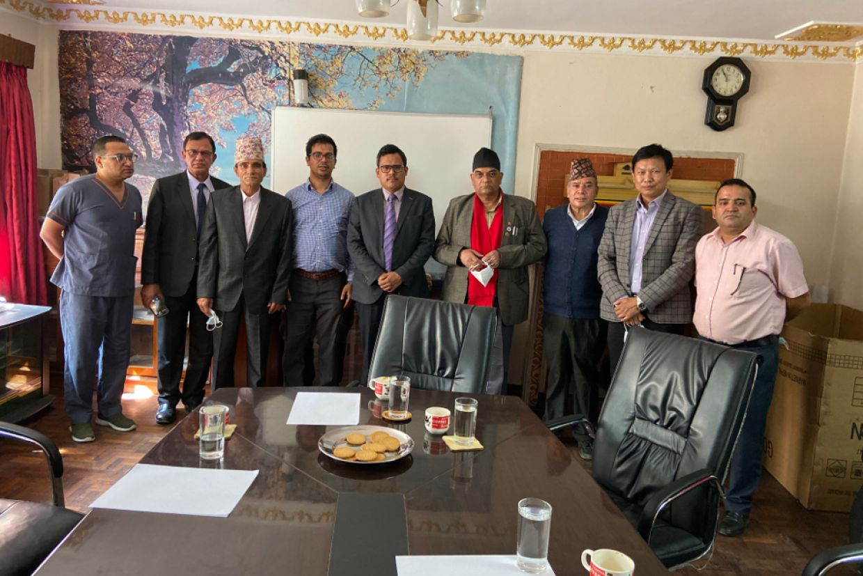 Dr. Bishal Gyawali (fourth from left) at a meeting in Nepal with colleagues from the Karnali Academy of Health Sciences.