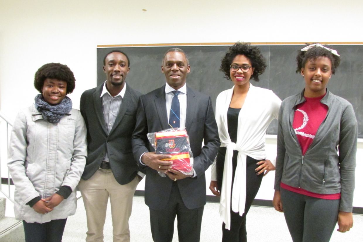 Hugh Fraser, centre, with members of the Queen’s Black Academic Society during a visit to Queen’s in 2014.