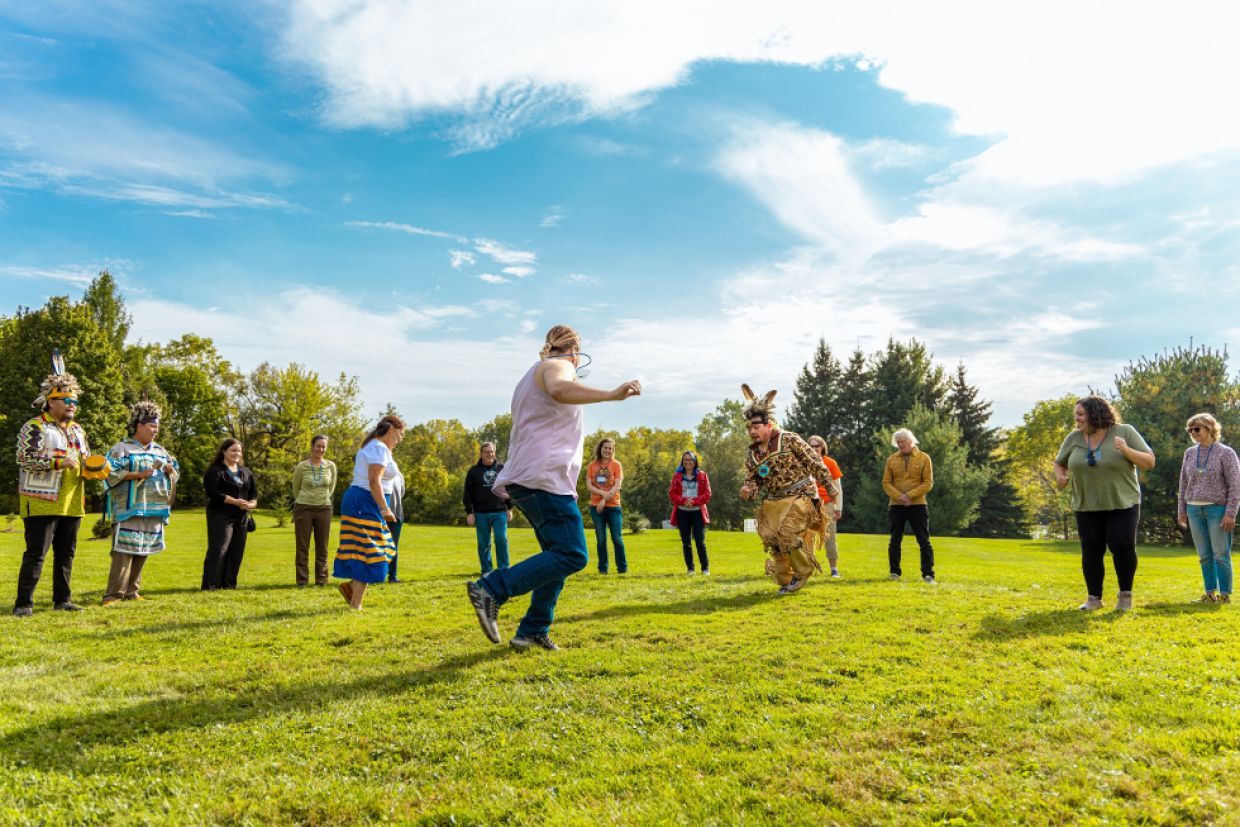 MITS participants take part in a dancing circle. 