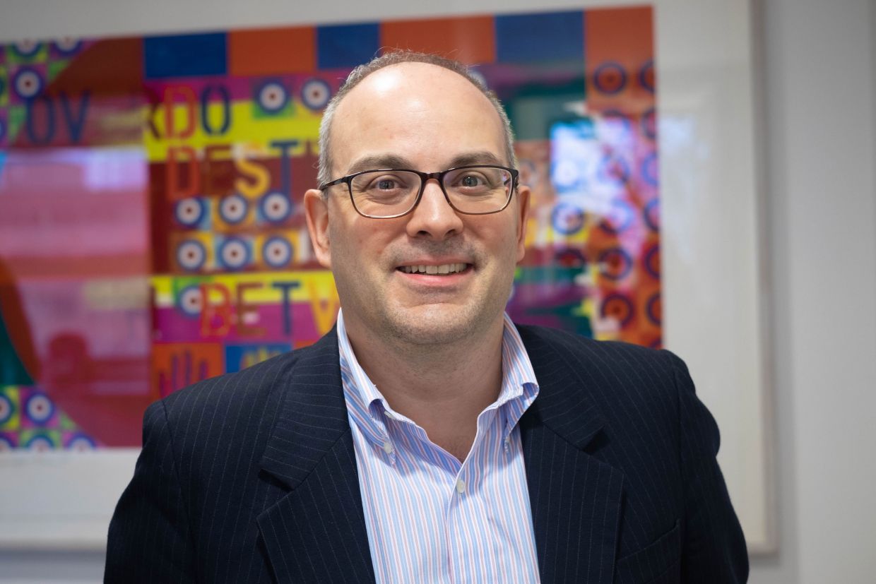 Stacy Kelly, Artsci'93, smiling and looking directly at the camera. 