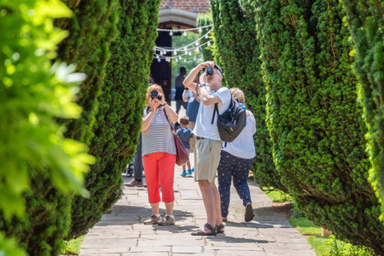 People tour the BISC Gardens