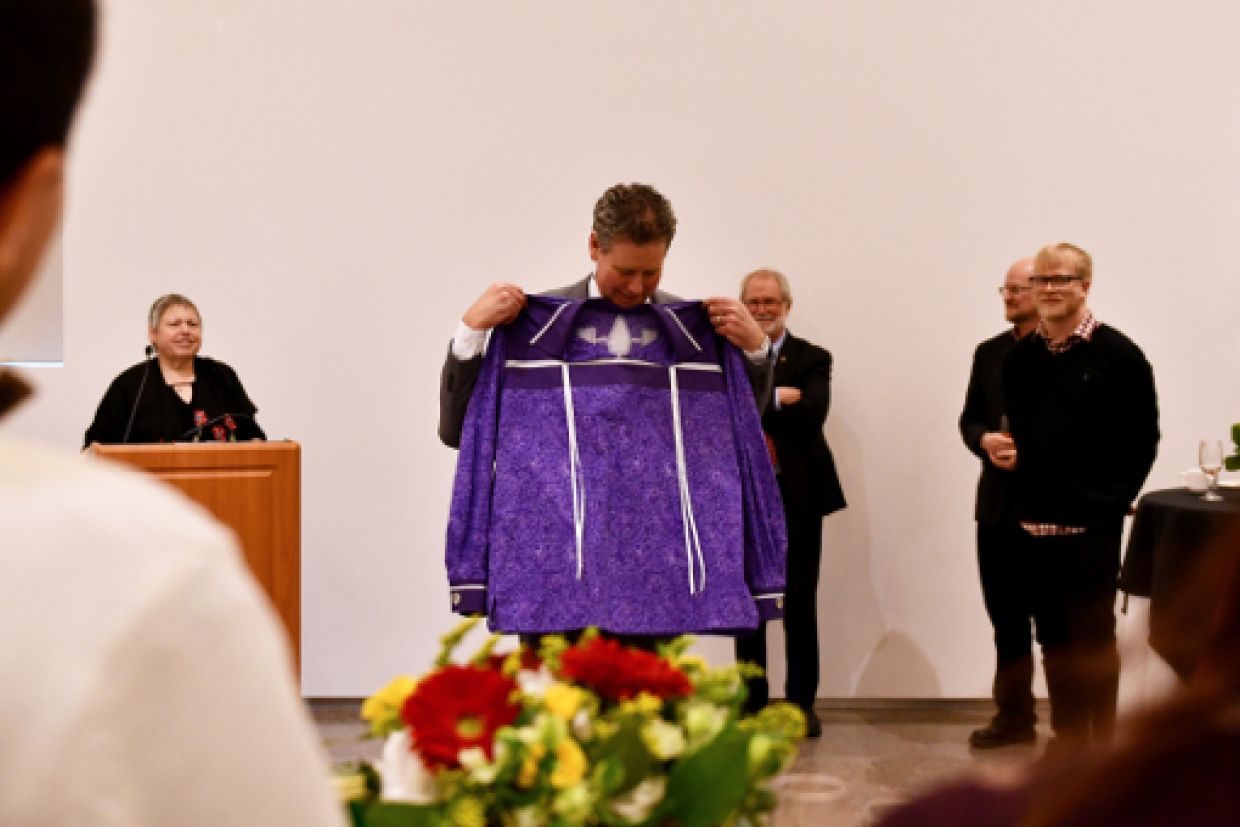 Mark Green receives a special ribbon shirt.