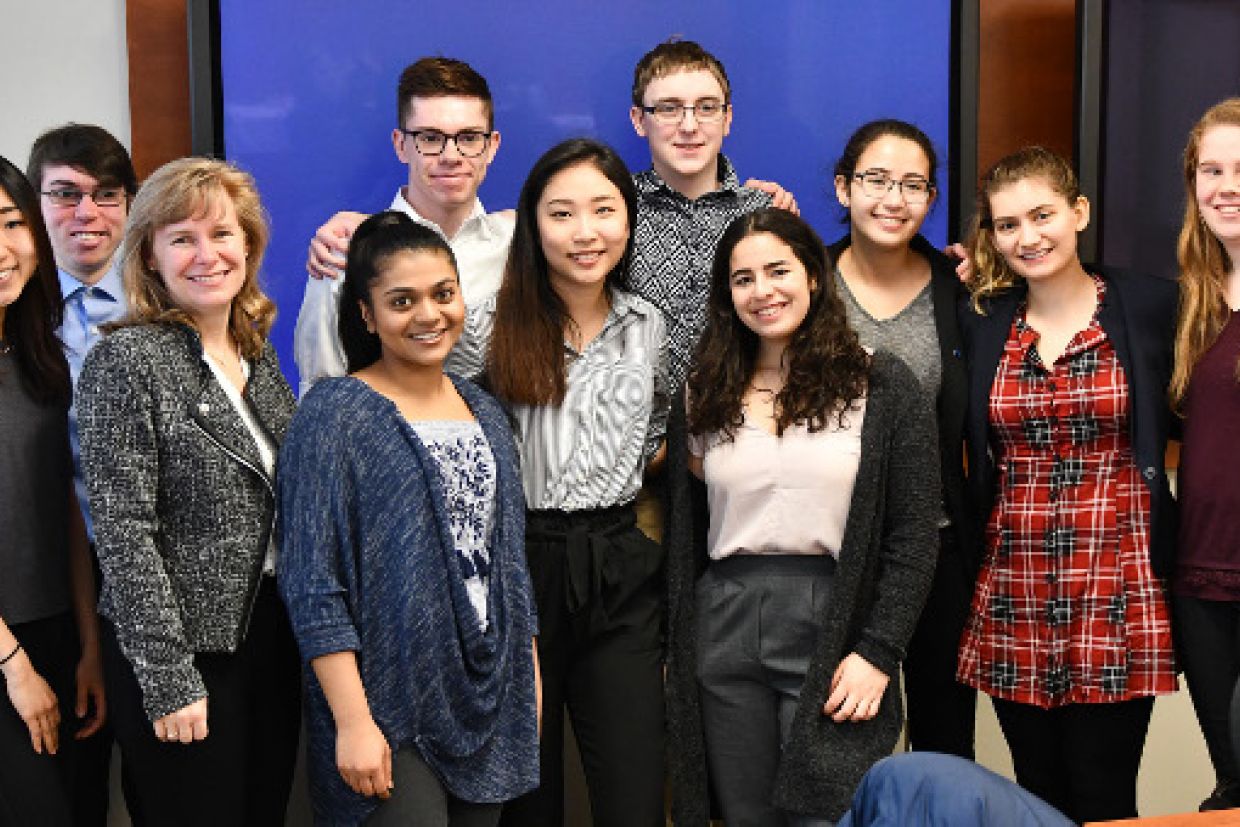 Schulich Leader Scholars at Queen's gather for a photo with Karen Bertrand, Vice-Principal (Advancement)