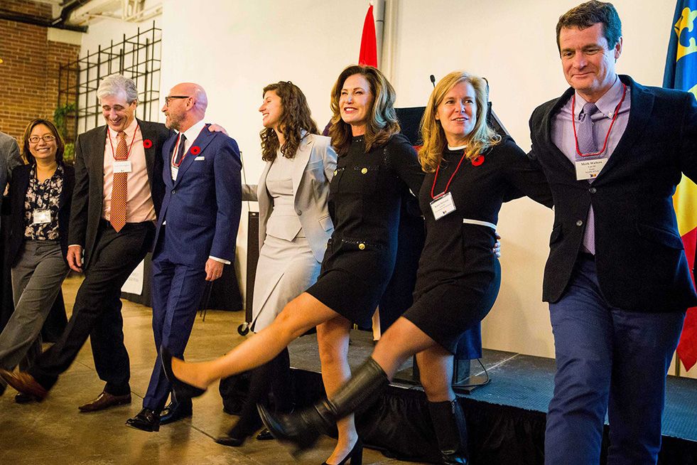 Alumni doing an Oil Thigh at the Johnson Award reception