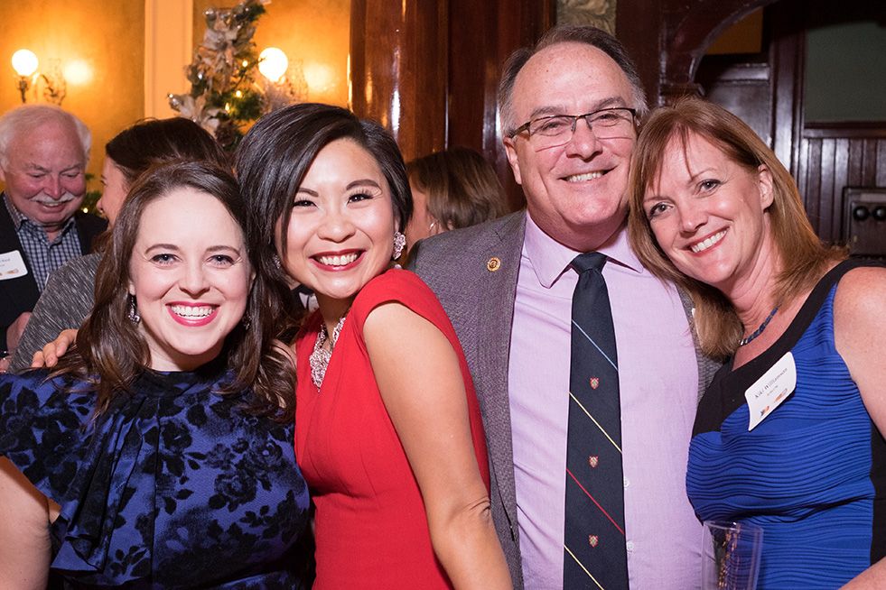 A group of alumni at the annual wine and cheese