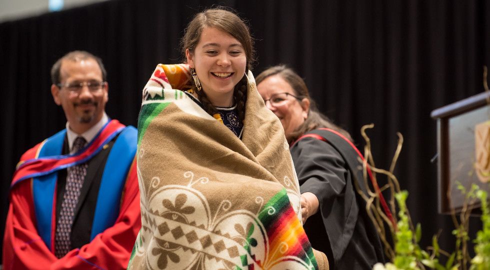 Spring Convocation blanket ceremony with Billie Kearns, Sc'19. Photo credit: Garrett Elliott