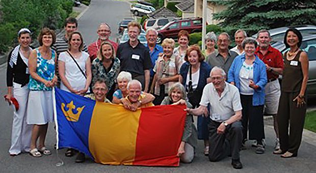 Okanagan alumni with flag