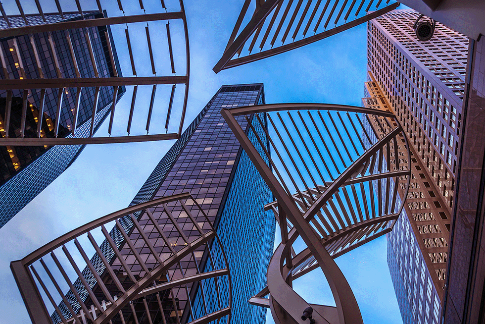 A view looking up through the Trees of Steel sculptures on Calgary's 8 Ave SW