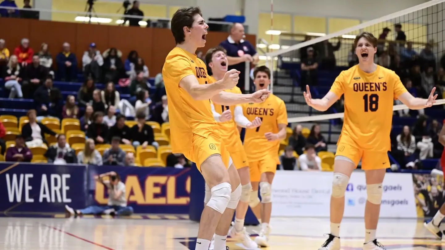 Queen's University Men's Volleyball celebrate a point victory at the ARC Main Gym.