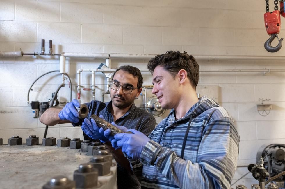 Students assemble mechanical parts 