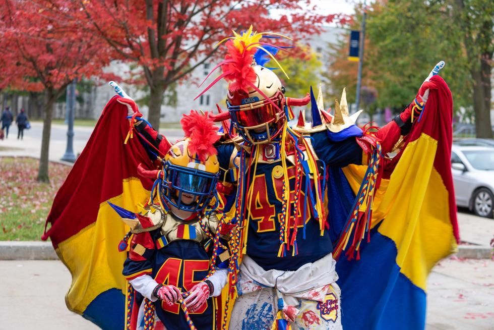 Queen's superfan in tricolour garb poses with his son superfan