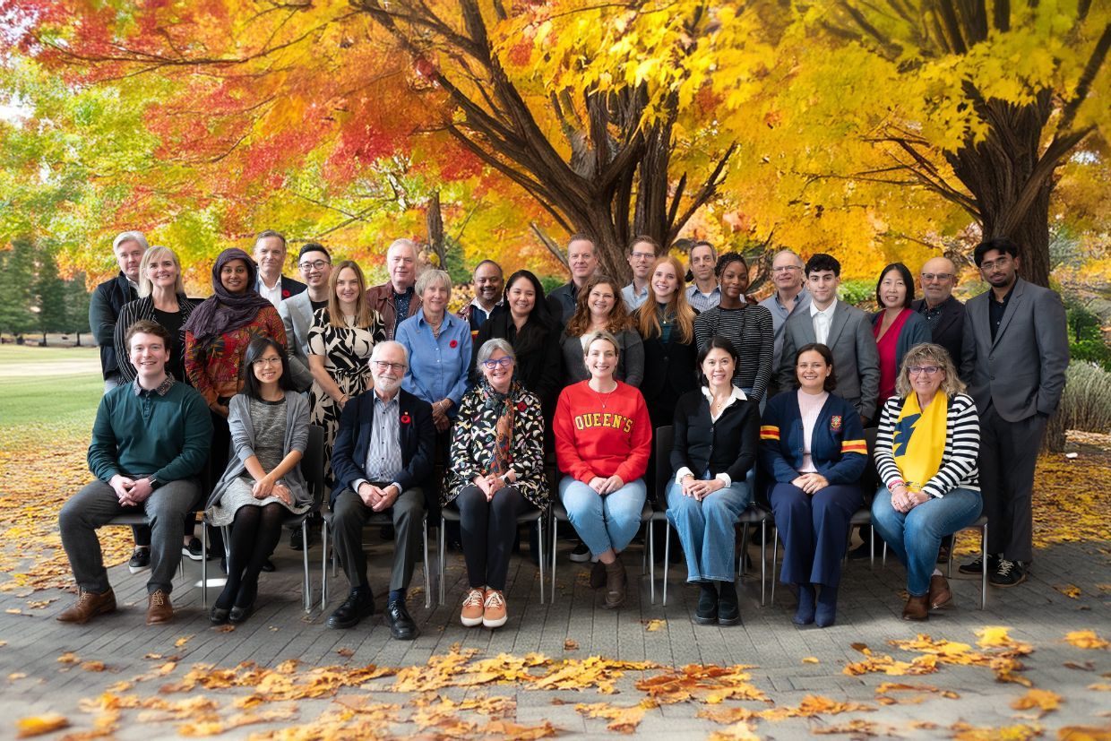 University Council pictured on campus, with a tree as background and fall colours.