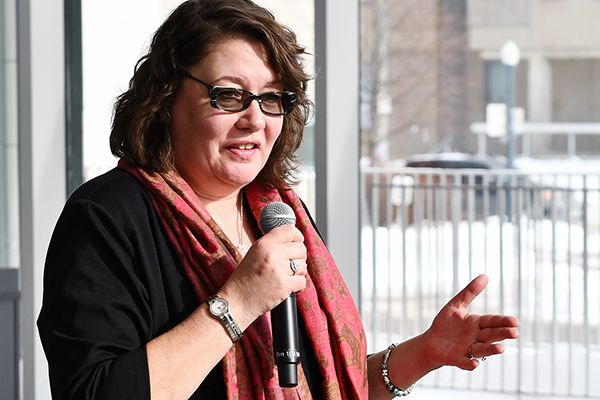 Heather Stuart speaking into a microphone.