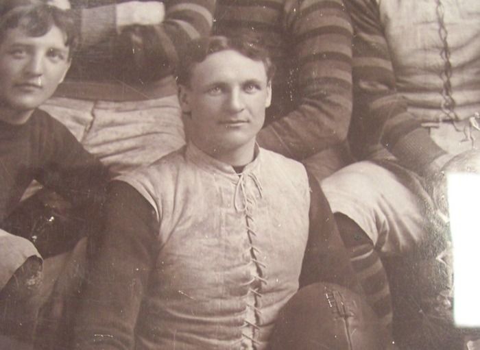 Guy Curtis holding a football
