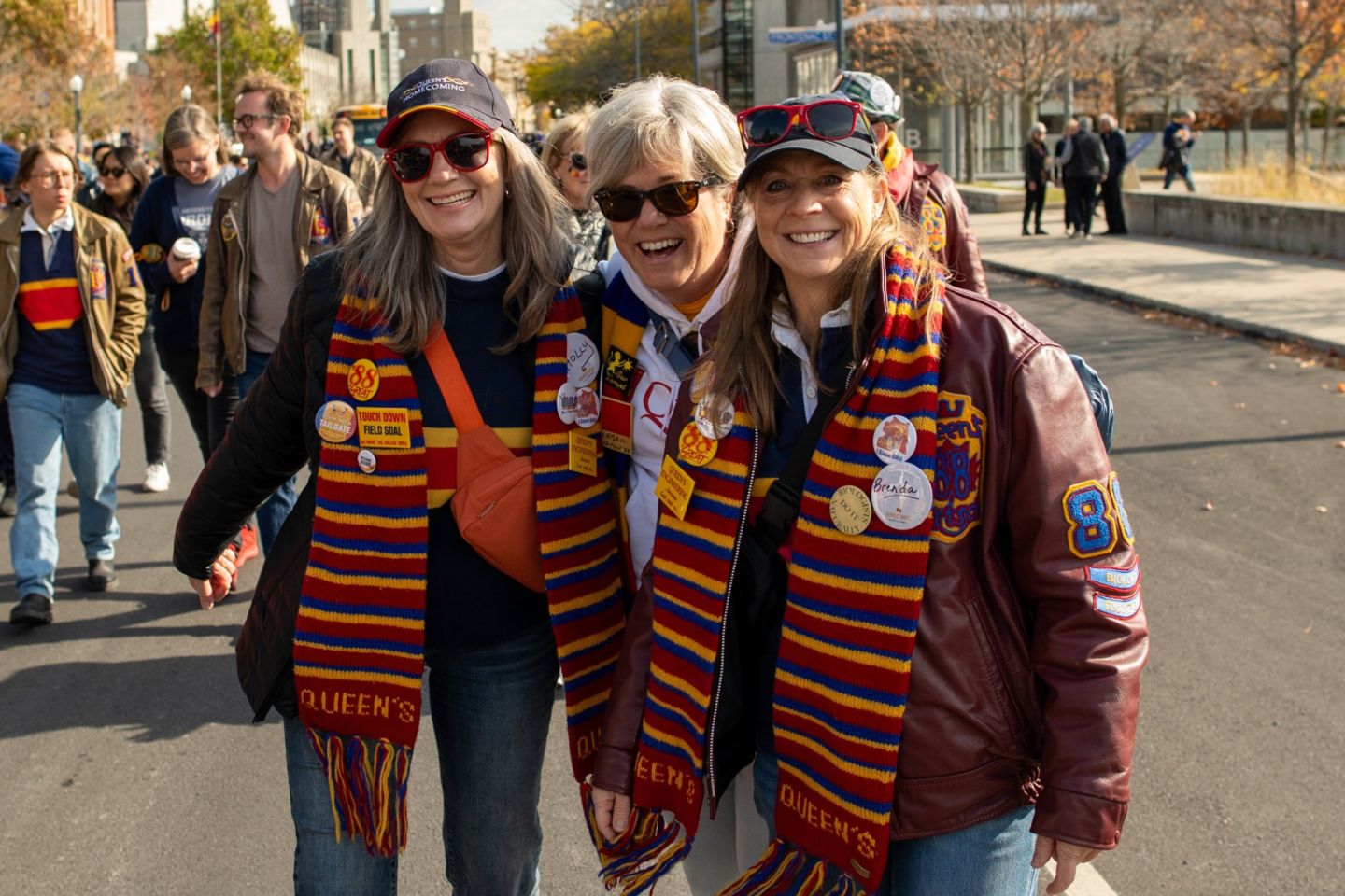 Alumni share a laugh during last year’s Alumni Parade to Richardson Stadium.
