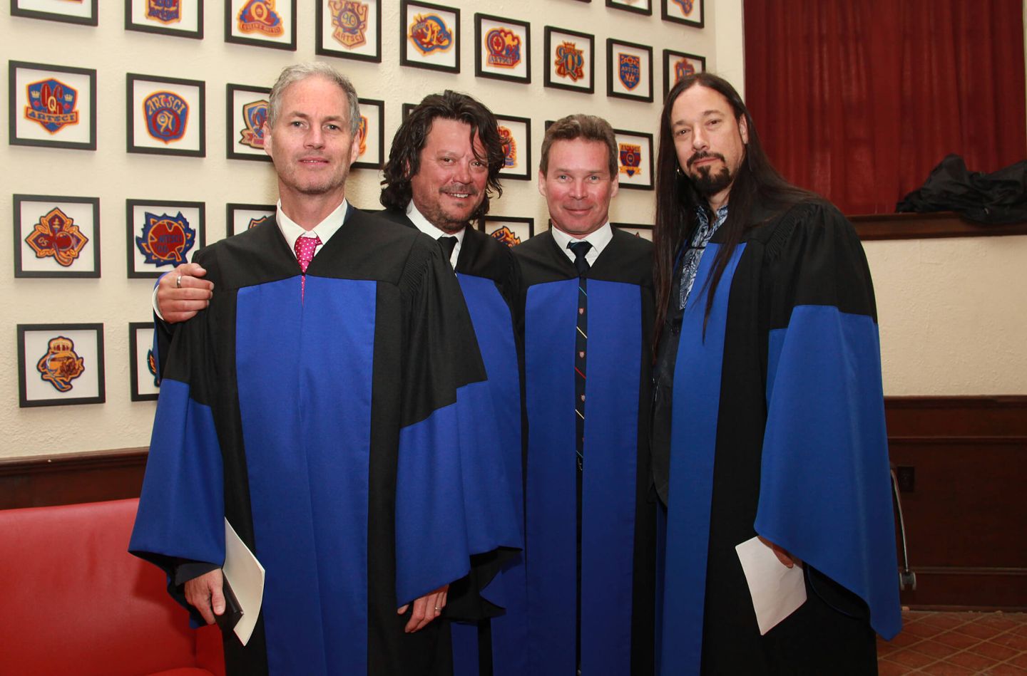 Tragically Hip members Johnny Fay, Paul Langlois, Gord Sinclair, and Rob Baker receive honorary degrees from Queen’s in Grant Hall on May 19, 2016, three months before the band’s final concert in Kingston. (Photo: Bernard Clark)
