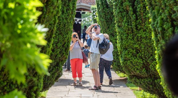 People tour the BISC Gardens
