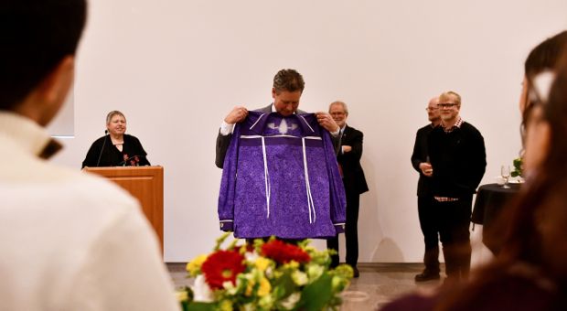 Mark Green receives a special ribbon shirt.