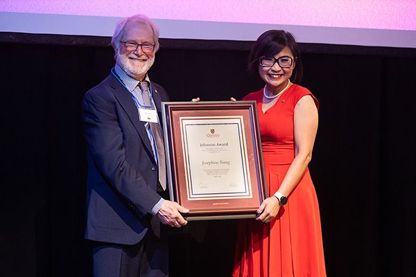 Josephine Tsang, PhD'06, receives the 2023 Johnson Award from Principal Deane