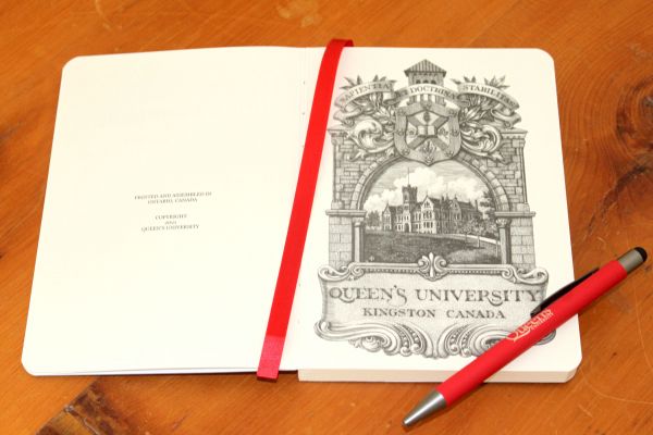 Image of notebook with drawing of Queen's inside