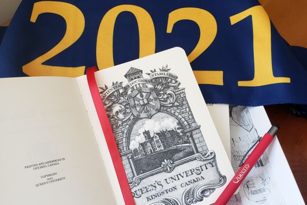 The Class of 2021 leather bound notebook, with a Class of 2021 pennant. 