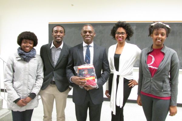 Hugh Fraser, centre, with members of the Queen’s Black Academic Society during a visit to Queen’s in 2014.