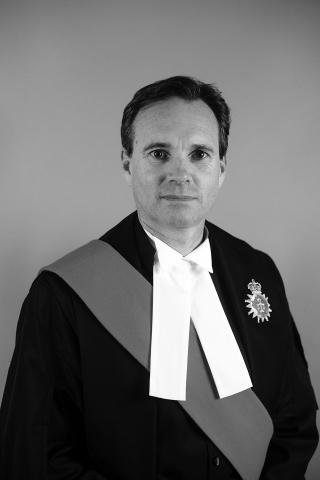 Photo of man in his judge robes.
