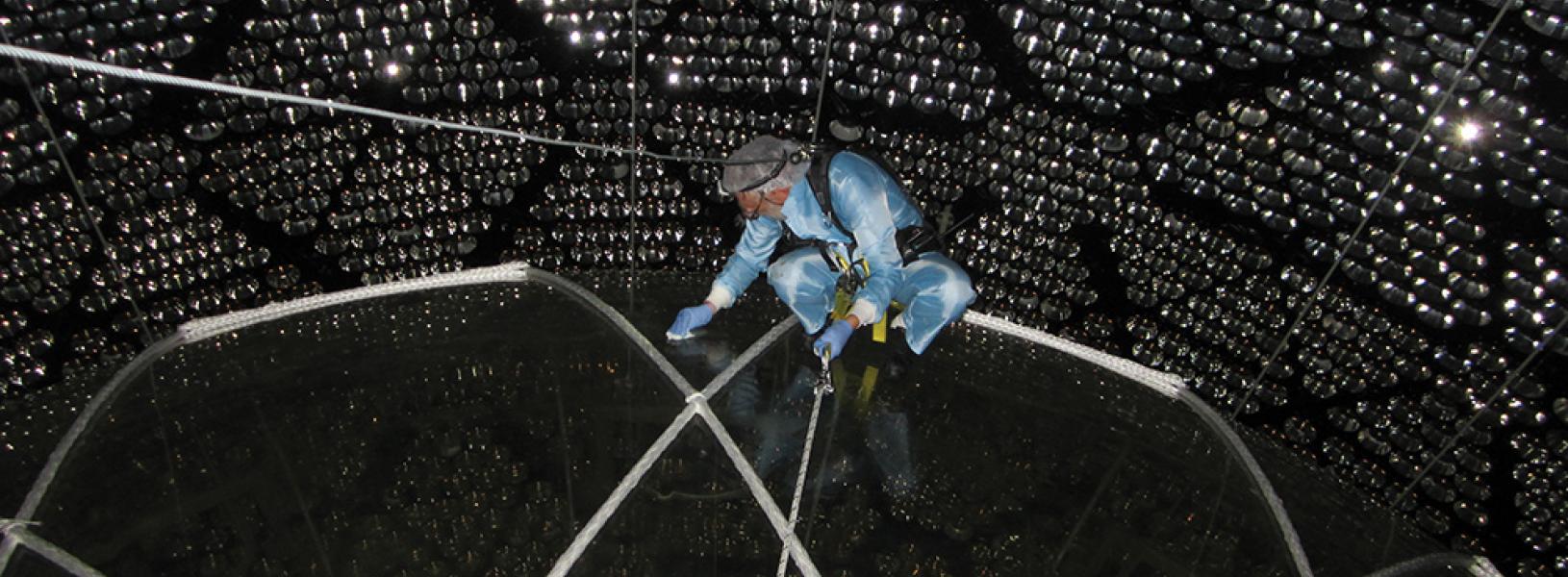 Peter Skensved accessing the top of the acrylic vessel of the SNO+ neutrino detector.