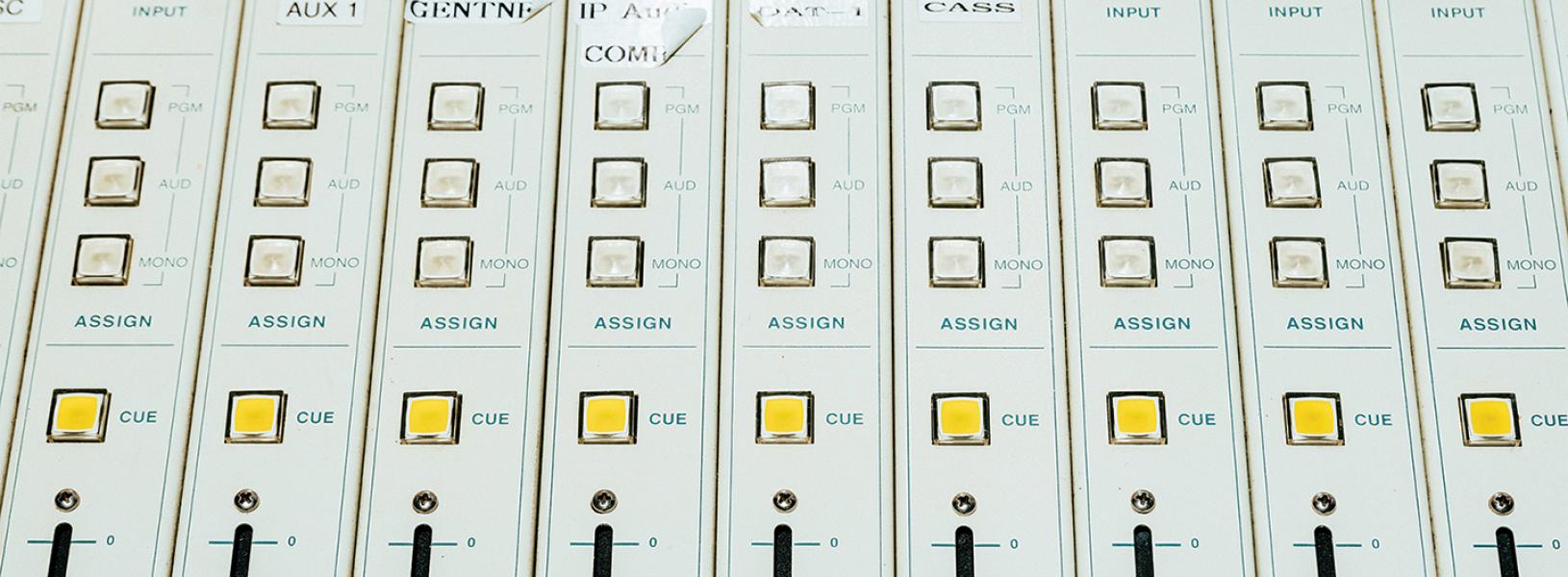 Overhead close-up of a radio station dashboard.