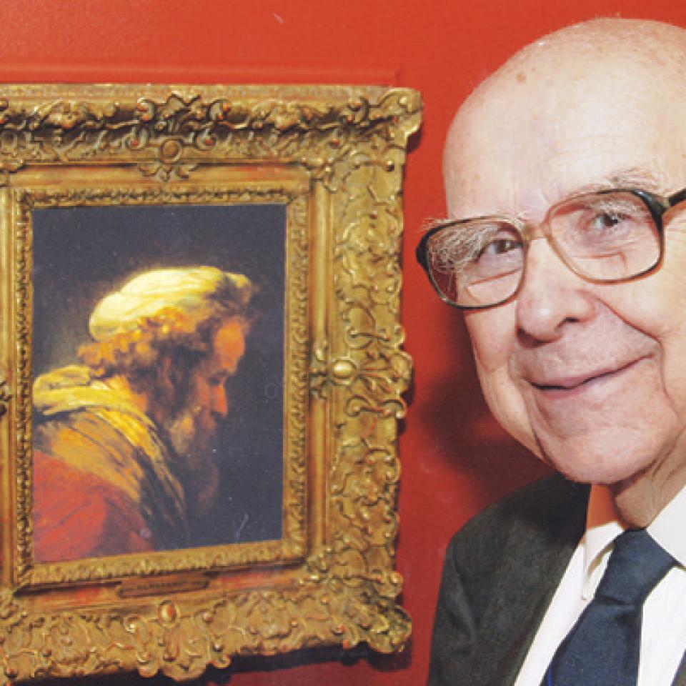 Alfred Bader next to a Rembrandt painting